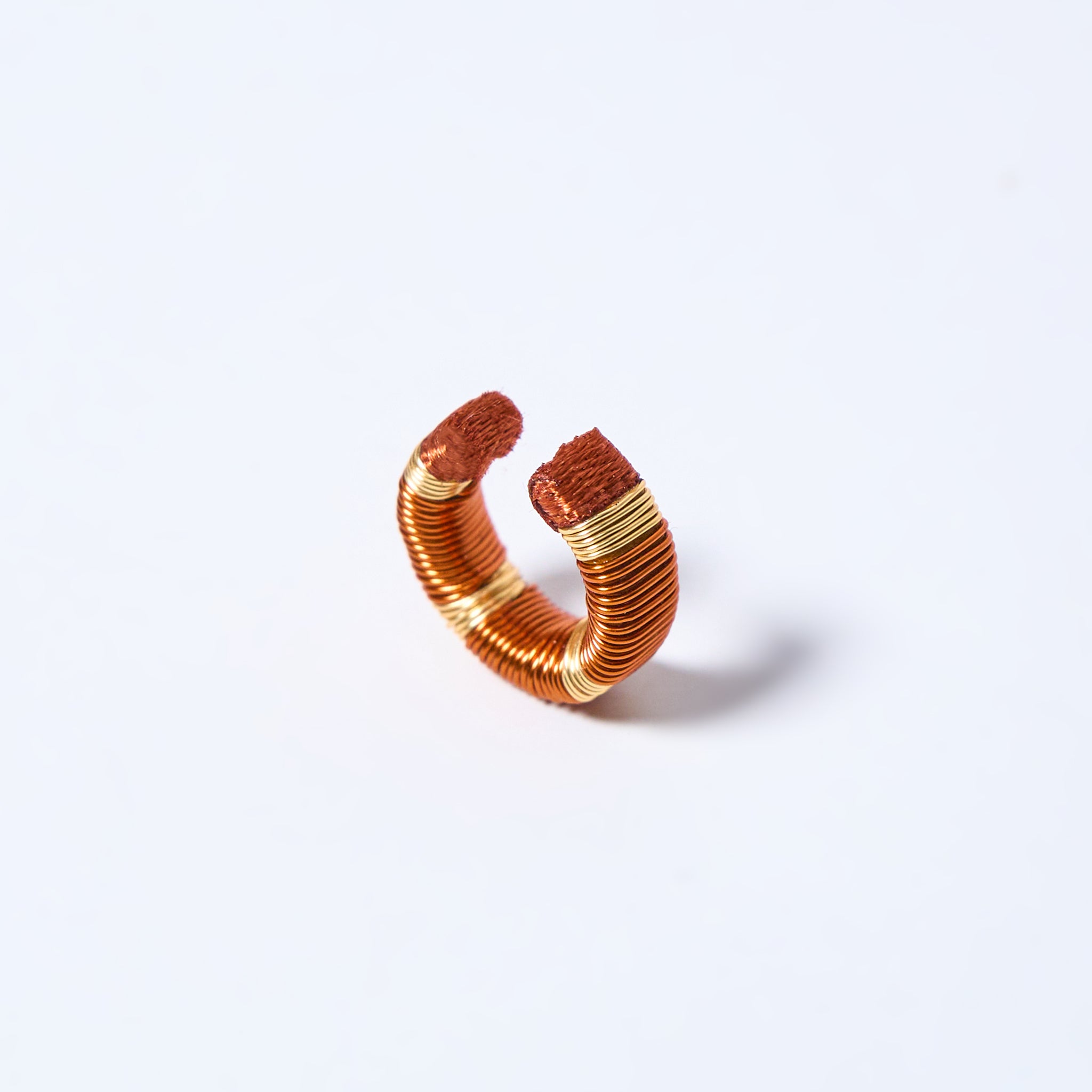 Handmade ear cuff striped in gold and copper