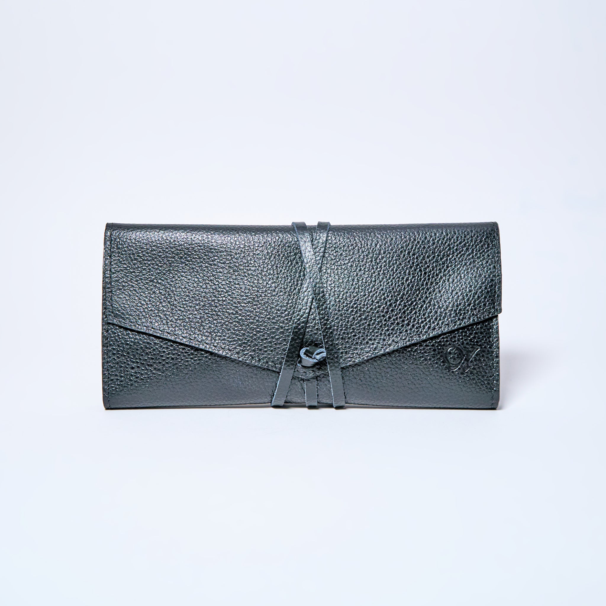 Black Onyx leather wallet on a light gray background. handcrafted by Oda Nova with space for 8 cards and bills