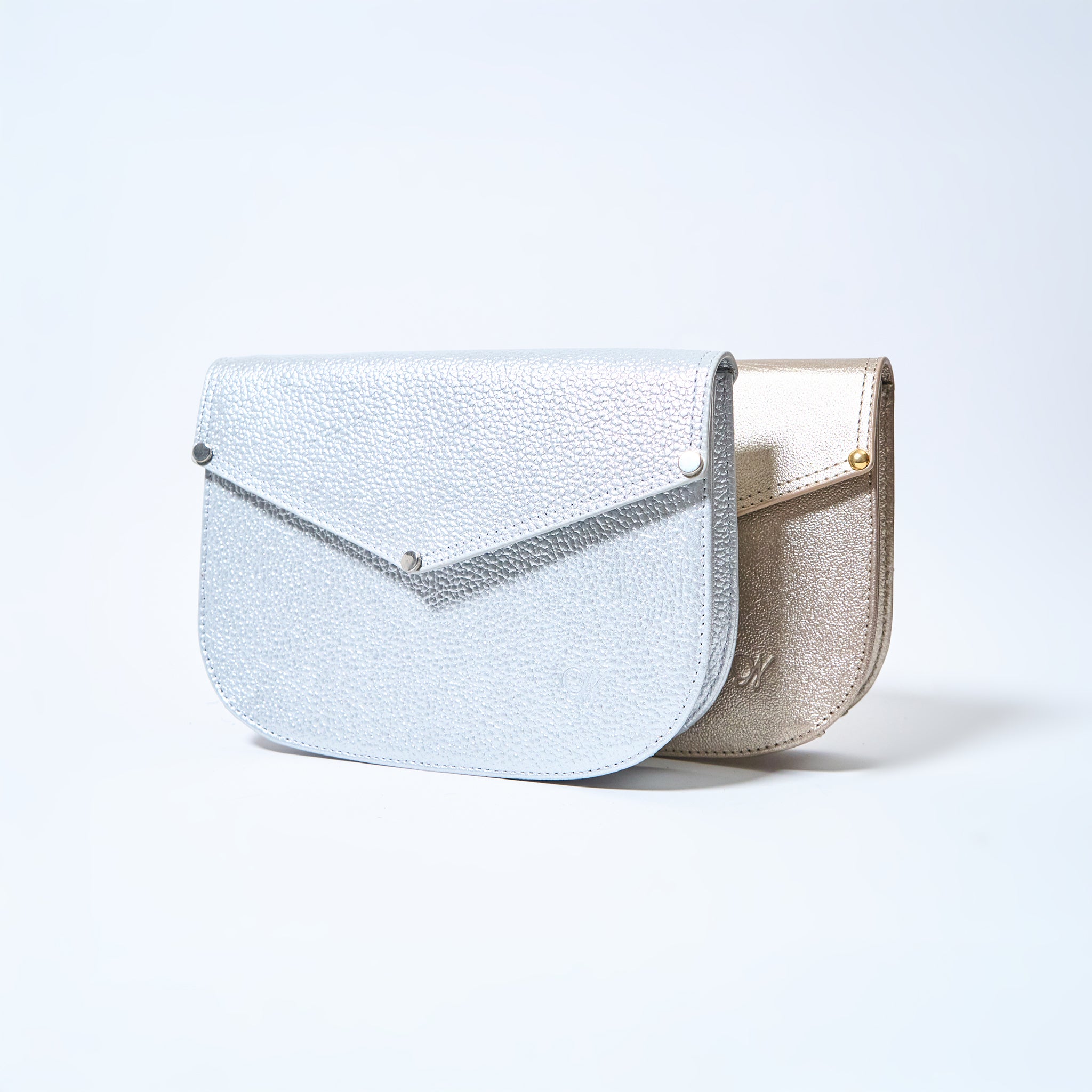 Lyra convertible leather crossbody bags in Stardust Grey and Stardust Gold with adjustable strap, can be worn as a shoulder bag, crossbody, or belt bag. Handcrafted by Oda Nova