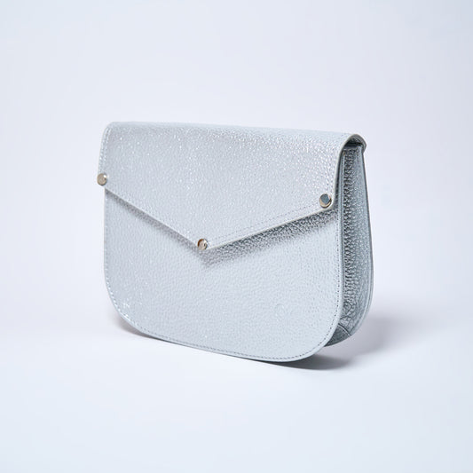 Lyra convertible leather crossbody bag in Stardust Grey with adjustable strap, can be worn as a shoulder bag, crossbody, or belt bag. Handcrafted by Oda Nova