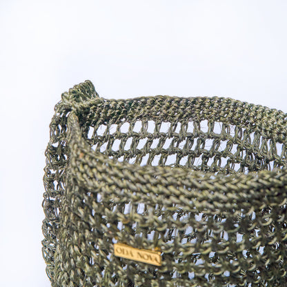 Close-up Aura Orbital Jade Dark Green crossbody woven bag handcrafted from natural fique fiber, designed by Oda Nova to honor feminine strength and Colombian craftsmanship.