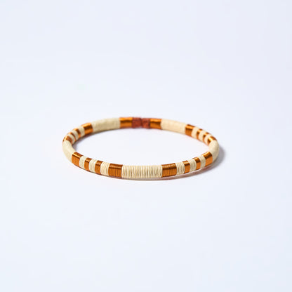 Handmade striped bracelet with copper and cream pattern