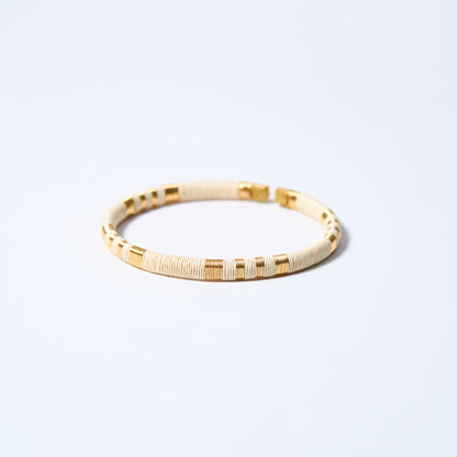 Handmade striped bracelet with cream and gold pattern