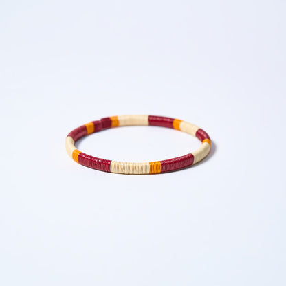 Handmade striped bracelet with wine, cream and mustard pattern