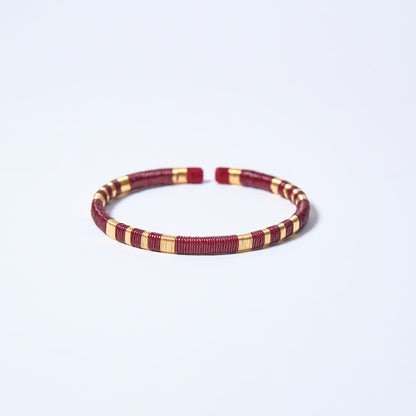 Handmade striped bracelet with wine red and gold pattern