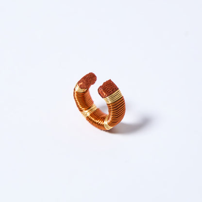 Handmade ear cuff striped in gold and copper