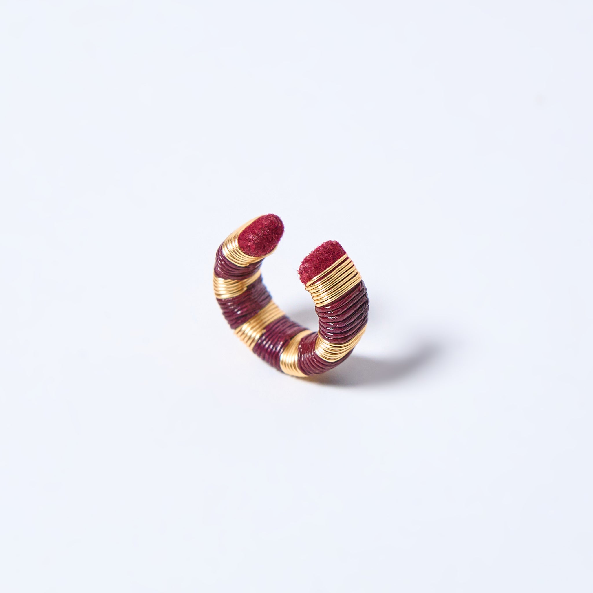 Handmade ear cuff striped in gold and wine