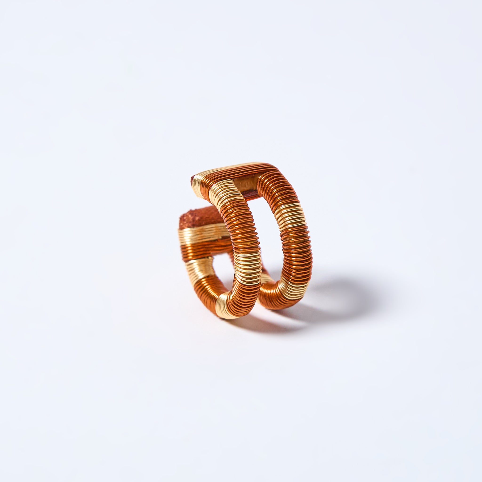 Handmade ear cuff striped in gold and copper