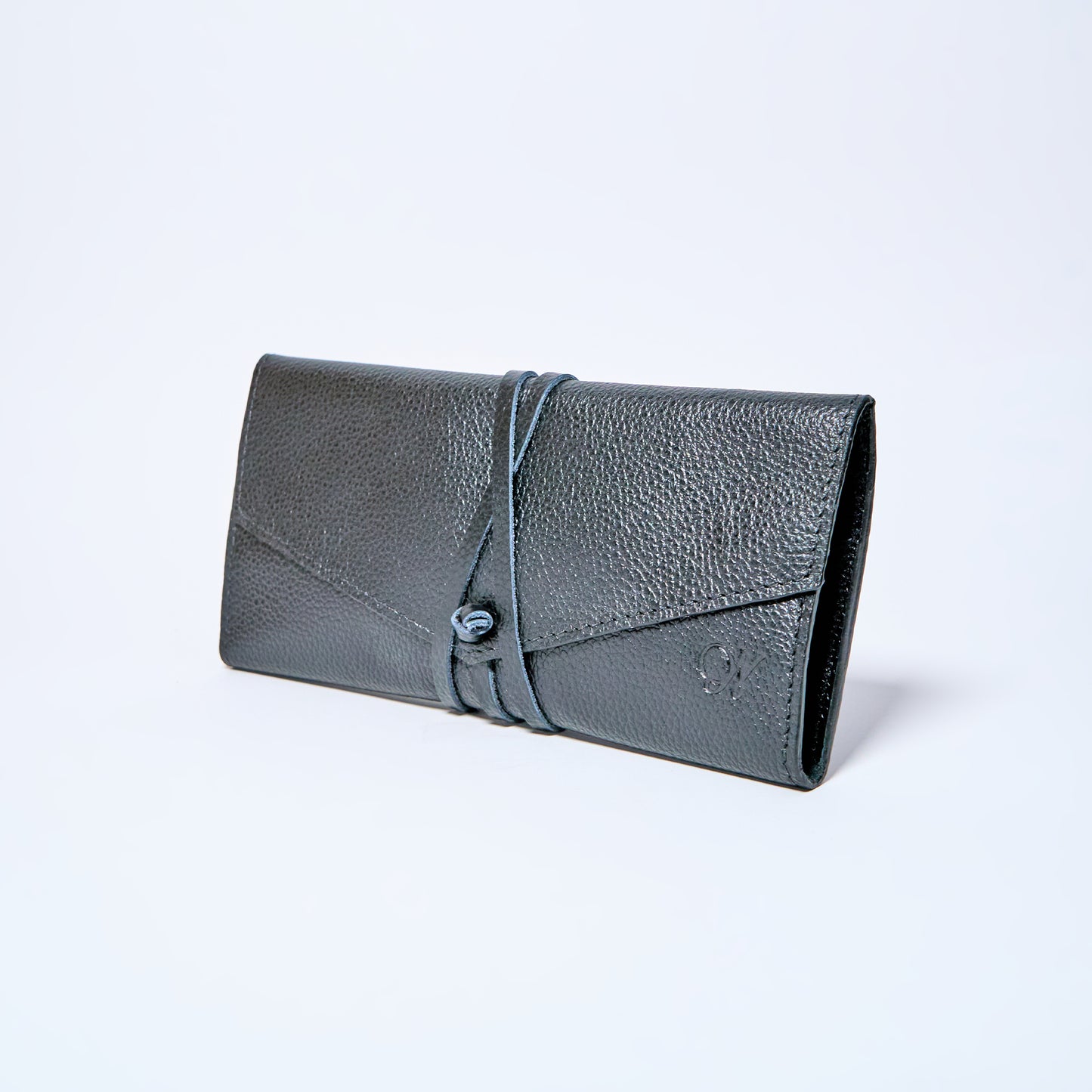 Black Onyx leather wallet on a light gray background. handcrafted by Oda Nova with space for 8 cards and bills