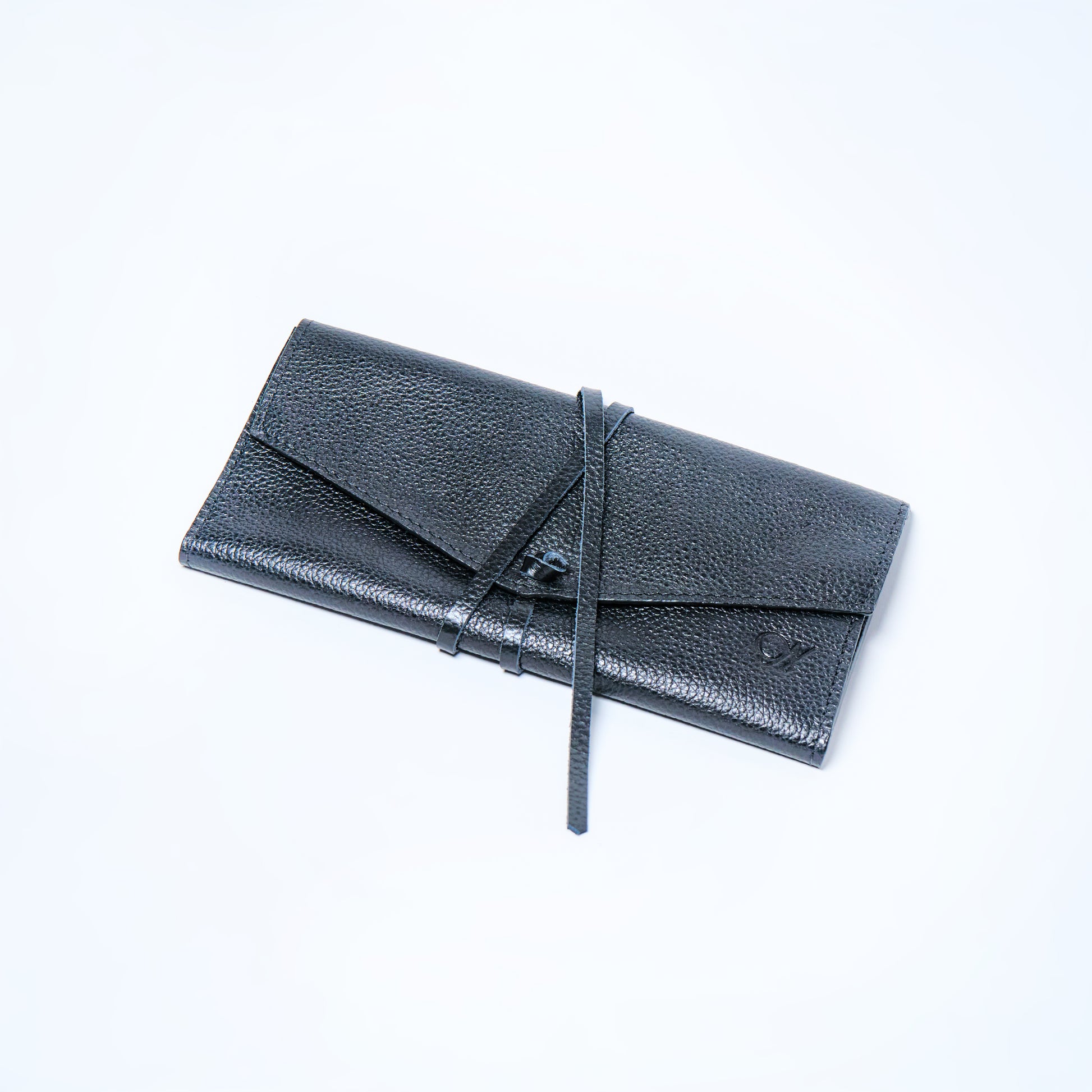 Black Onyx leather wallet on a light gray background. handcrafted by Oda Nova with space for 8 cards and bills