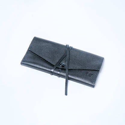 Black Onyx leather wallet on a light gray background. handcrafted by Oda Nova with space for 8 cards and bills