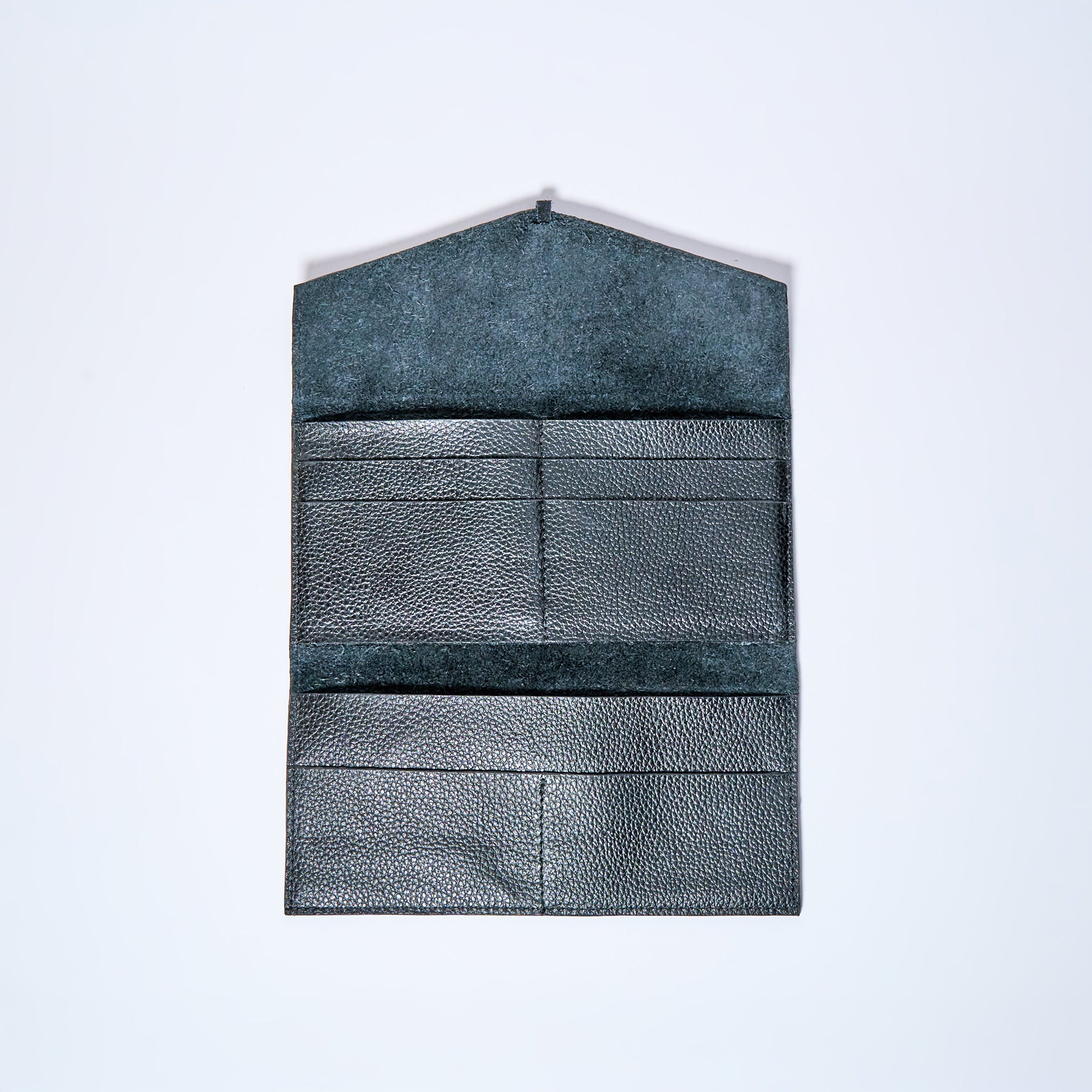 Black Onyx leather wallet interior on a light gray background. handcrafted by Oda Nova with space for 8 cards and bills