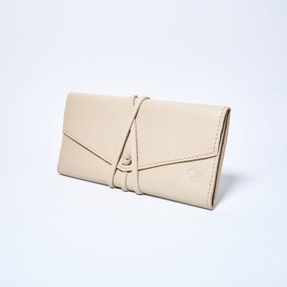 Cream leather wallet on a light gray background. handcrafted by Oda Nova with space for 8 cards and bills