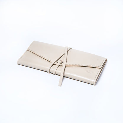 Cream leather wallet on a light gray background. handcrafted by Oda Nova with space for 8 cards and bills