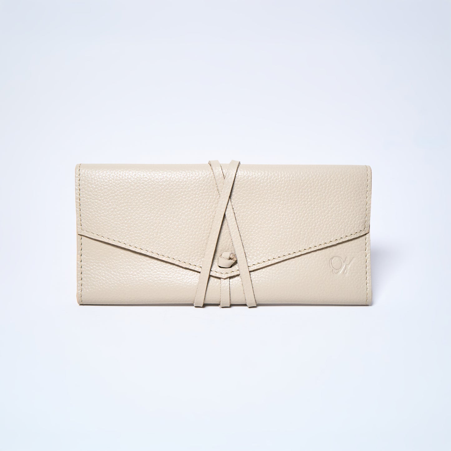 Cream 100% leather wallet with a brand logo on a light gray background