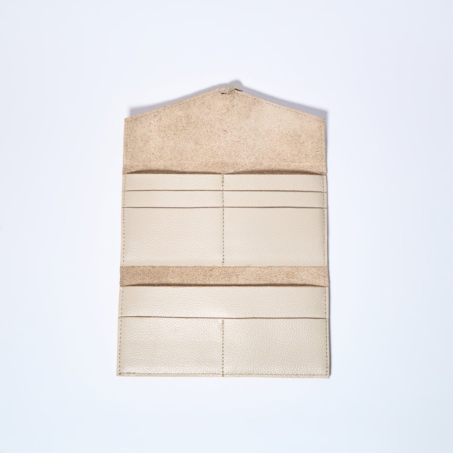 Cream leather wallet interior on a light gray background. handcrafted by Oda Nova with space for 8 cards and bills