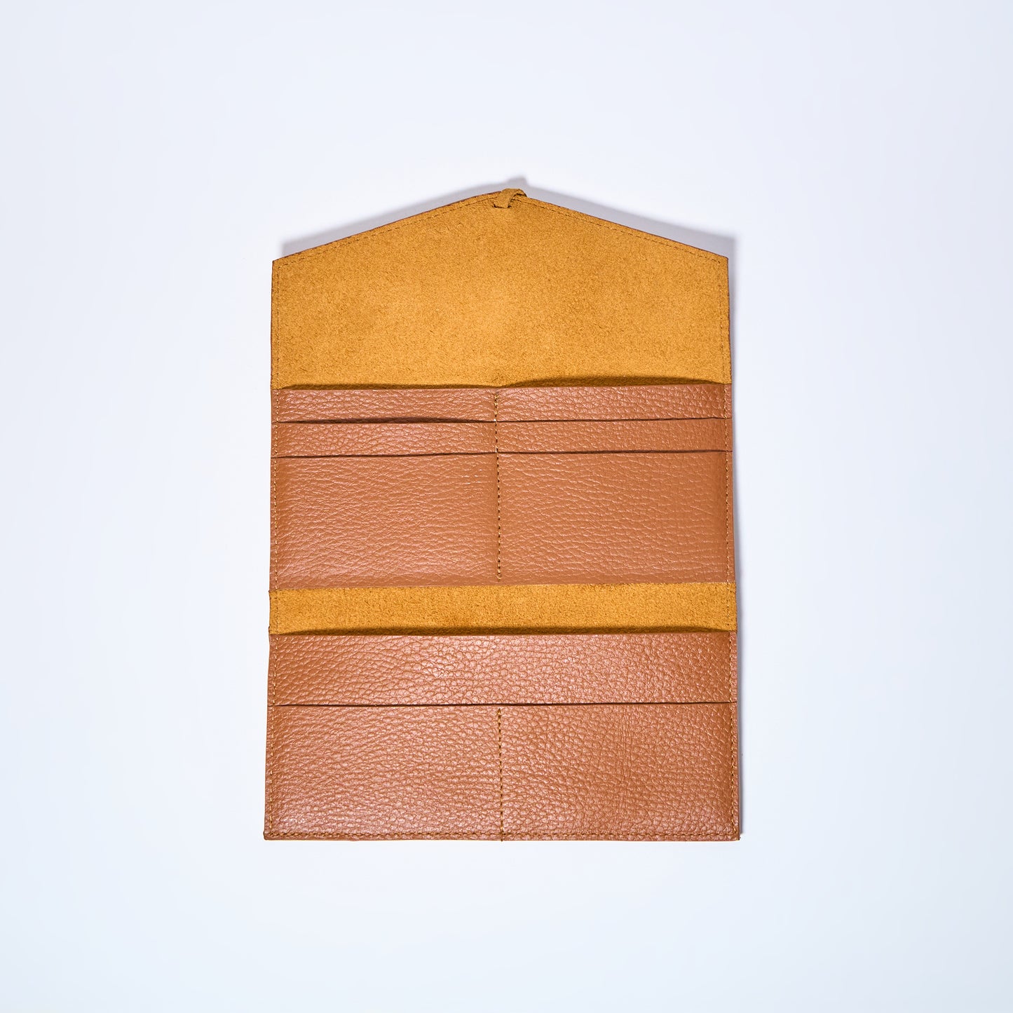 Honey Brown leather wallet interior on a light gray background. handcrafted by Oda Nova with space for 8 cards and bills