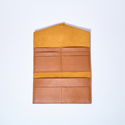 Honey Brown leather wallet interior on a light gray background. handcrafted by Oda Nova with space for 8 cards and bills