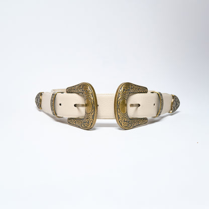 Pair of white leather belts with gold buckles on a light gray background