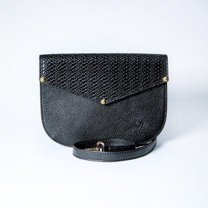 Lyra convertible leather crossbody bag in Black Onyx with adjustable strap, can be worn as a shoulder bag, crossbody, or belt bag. Handcrafted by Oda Nova