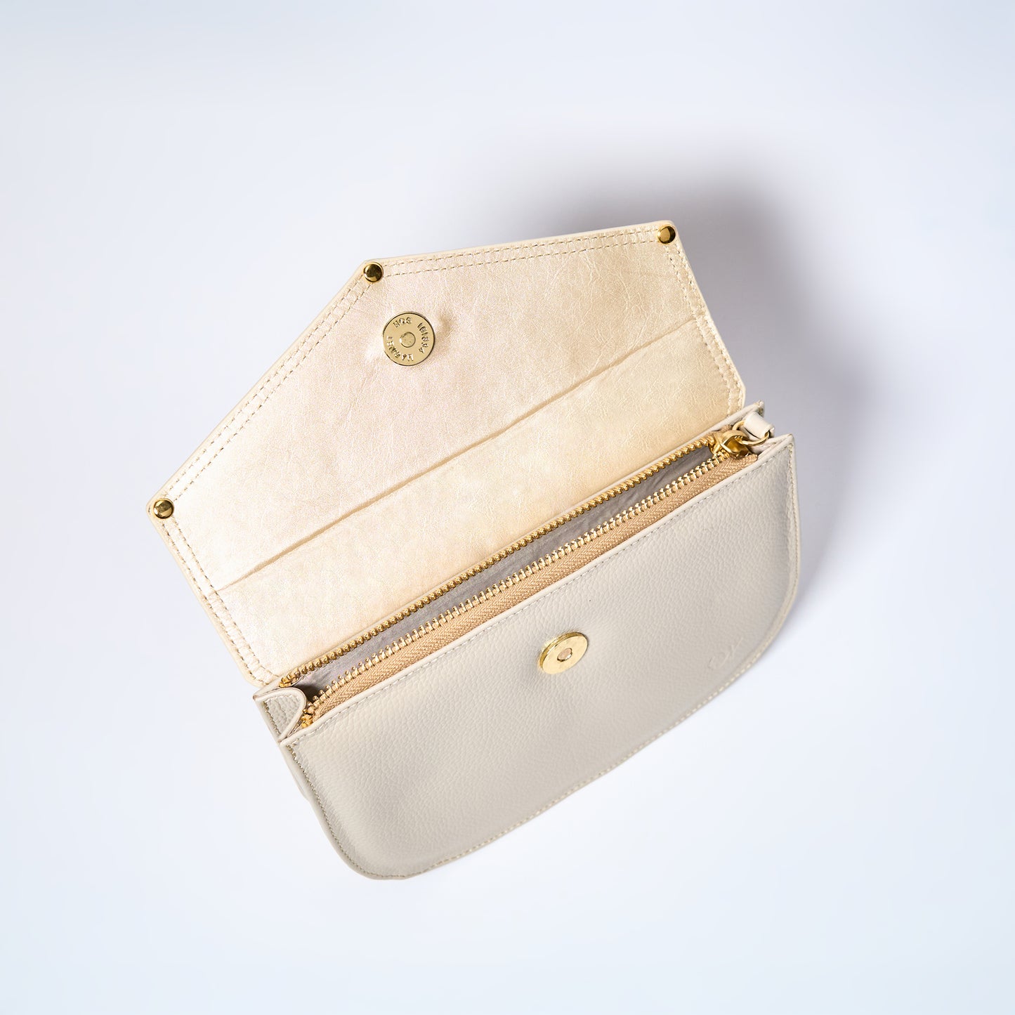 Lyra convertible leather crossbody bag interior in Cream with adjustable strap, can be worn as a shoulder bag, crossbody, or belt bag. Handcrafted by Oda Nova
