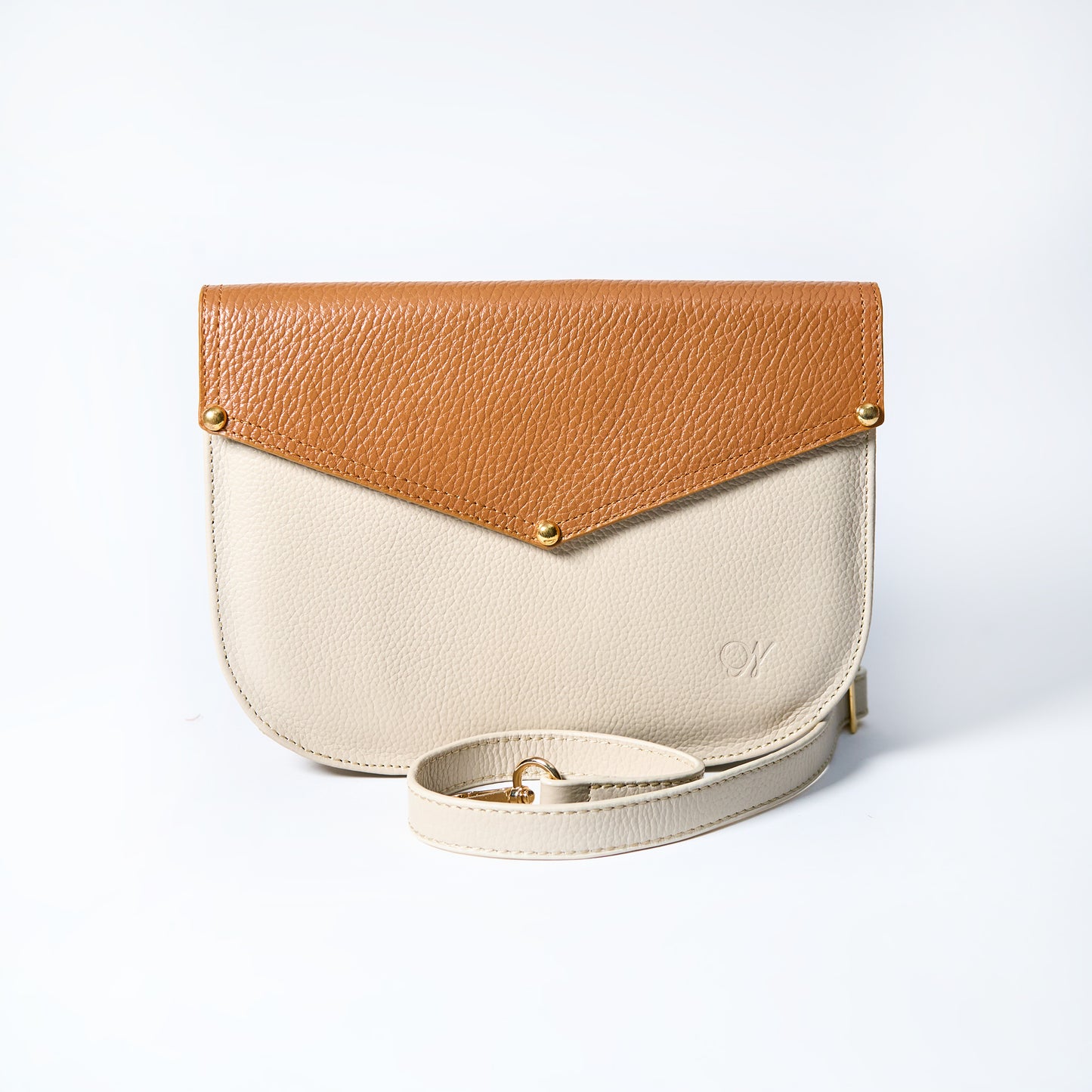 Lyra convertible leather crossbody bag in Honey Brown & Cream with adjustable strap, can be worn as a shoulder bag, crossbody, or belt bag. Handcrafted by Oda Nova