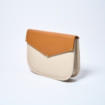 Lyra convertible leather crossbody bag in Honey Brown & Cream with adjustable strap, can be worn as a shoulder bag, crossbody, or belt bag. Handcrafted by Oda Nova