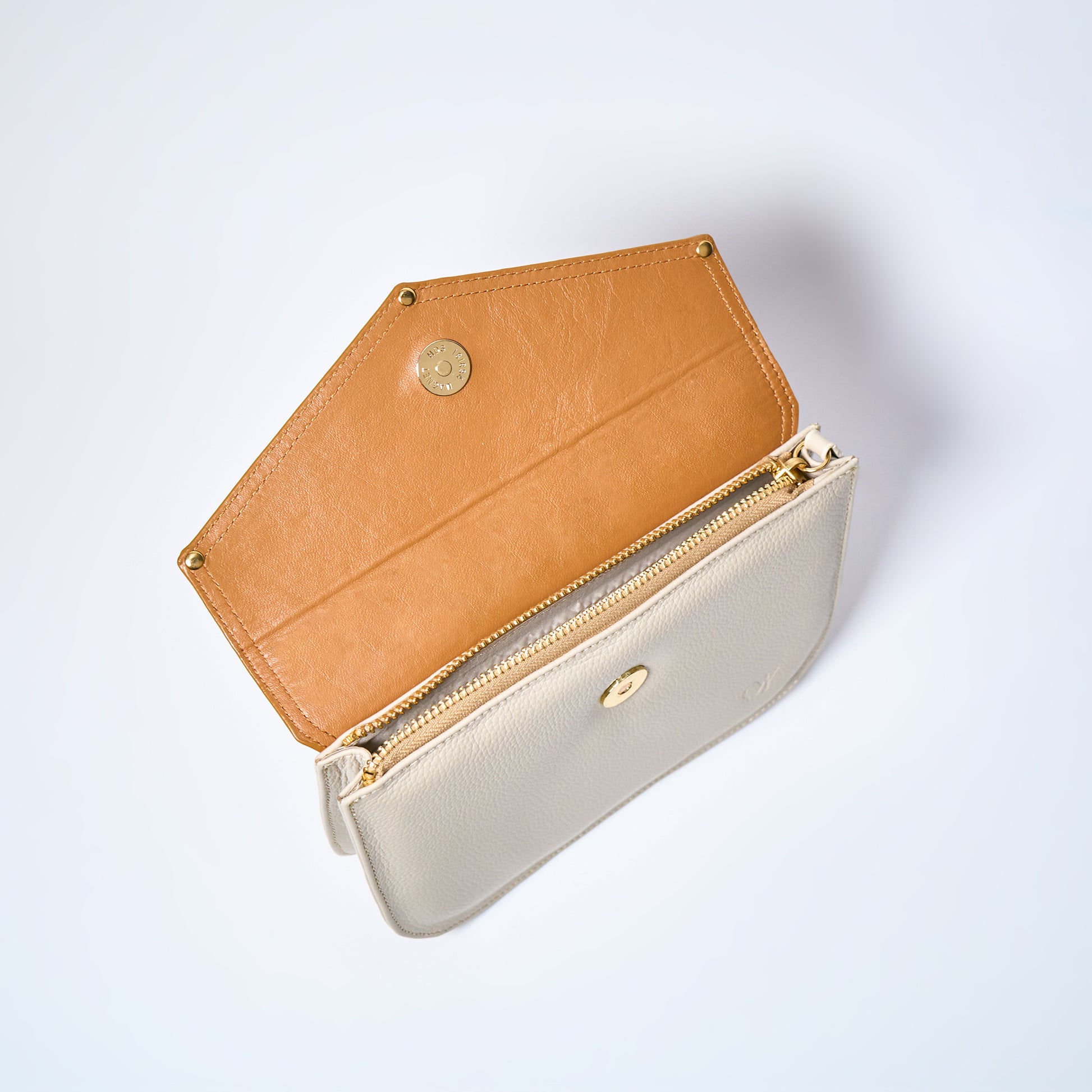 Lyra convertible leather crossbody bag in Honey Brown & Cream with adjustable strap, can be worn as a shoulder bag, crossbody, or belt bag. Handcrafted by Oda Nova