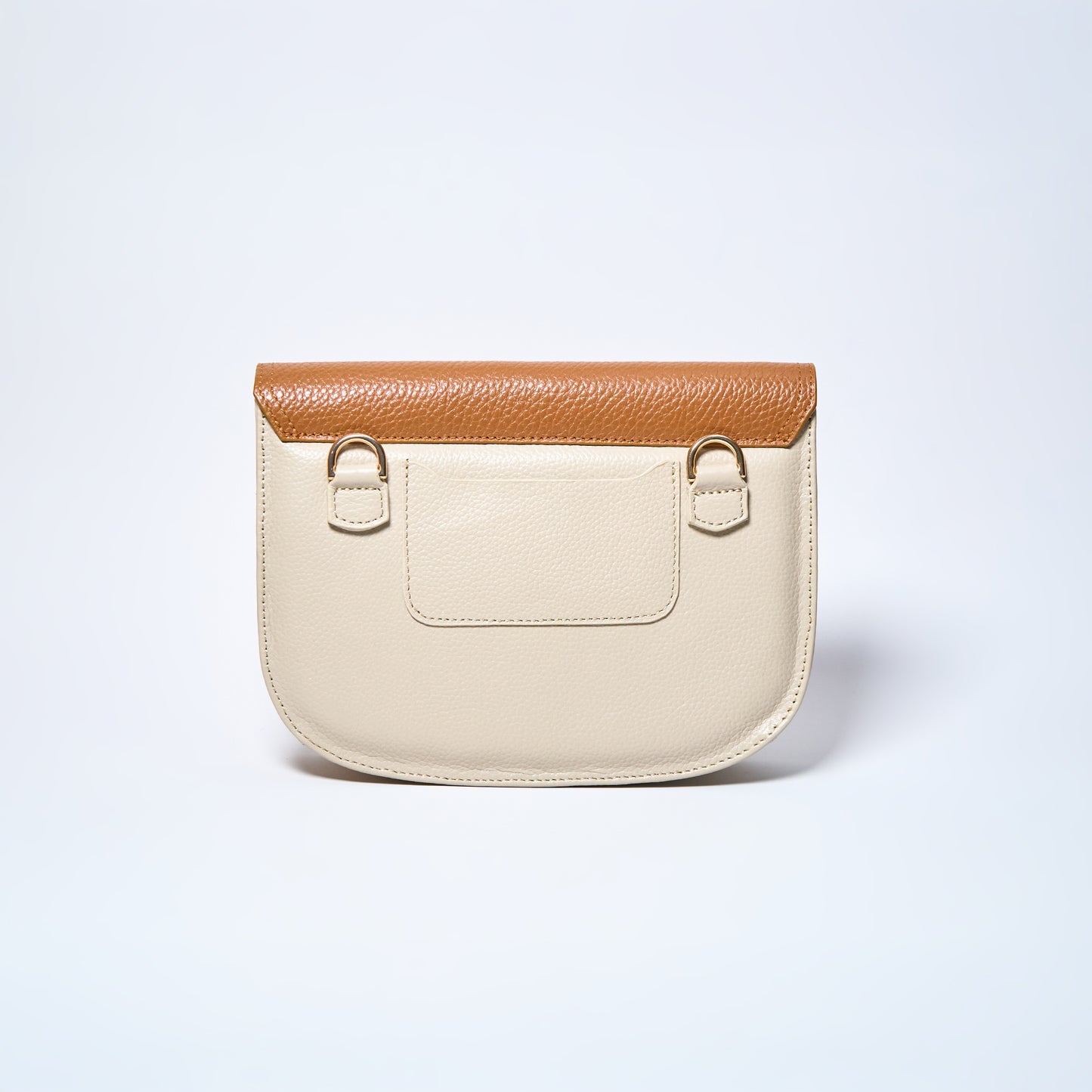 Backside of Lyra convertible leather crossbody bag in Honey Brown & Cream with adjustable strap, can be worn as a shoulder bag, crossbody, or belt bag. Handcrafted by Oda Nova