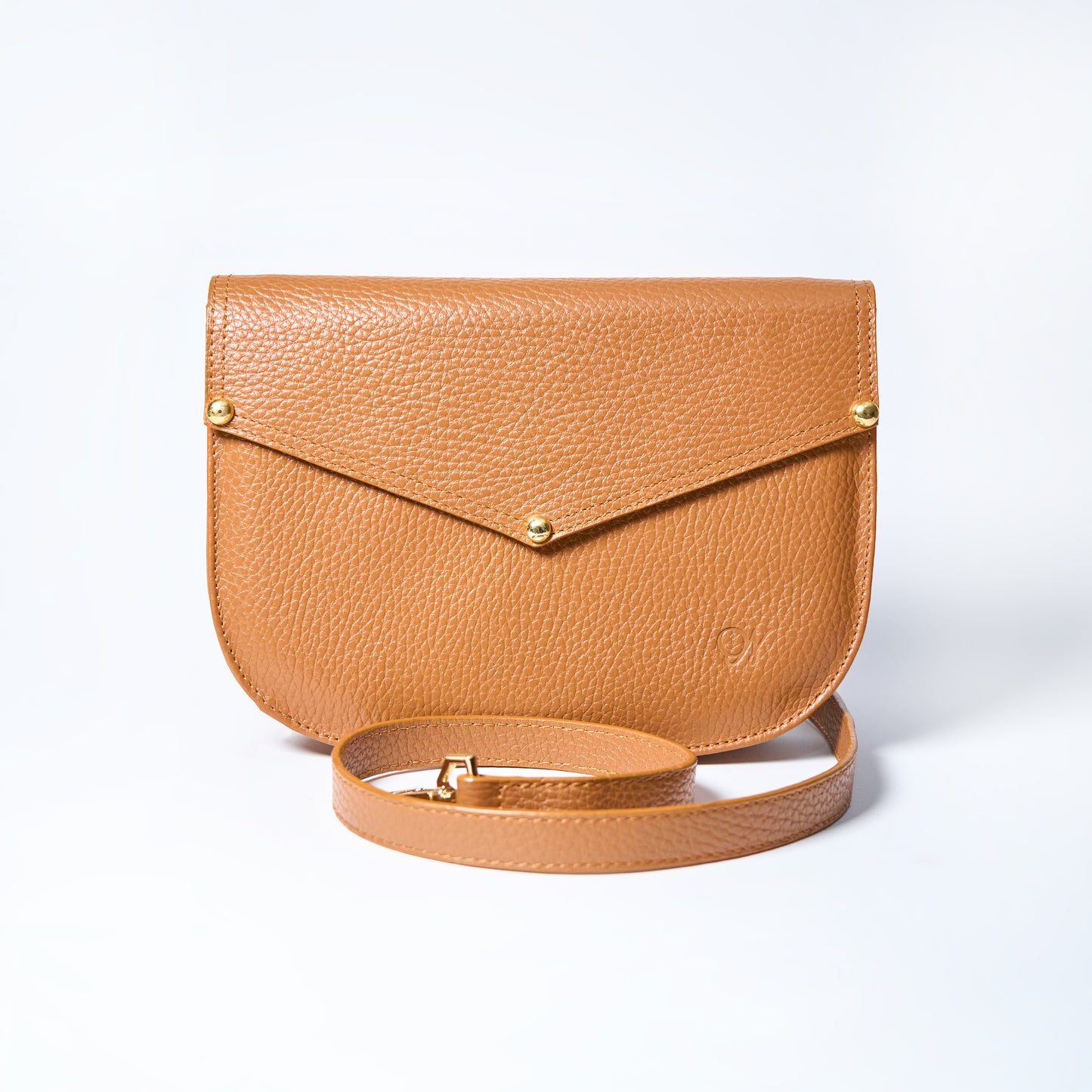 Lyra convertible leather crossbody bag in Honey Brown with adjustable strap, can be worn as a shoulder bag, crossbody, or belt bag. Handcrafted by Oda Nova