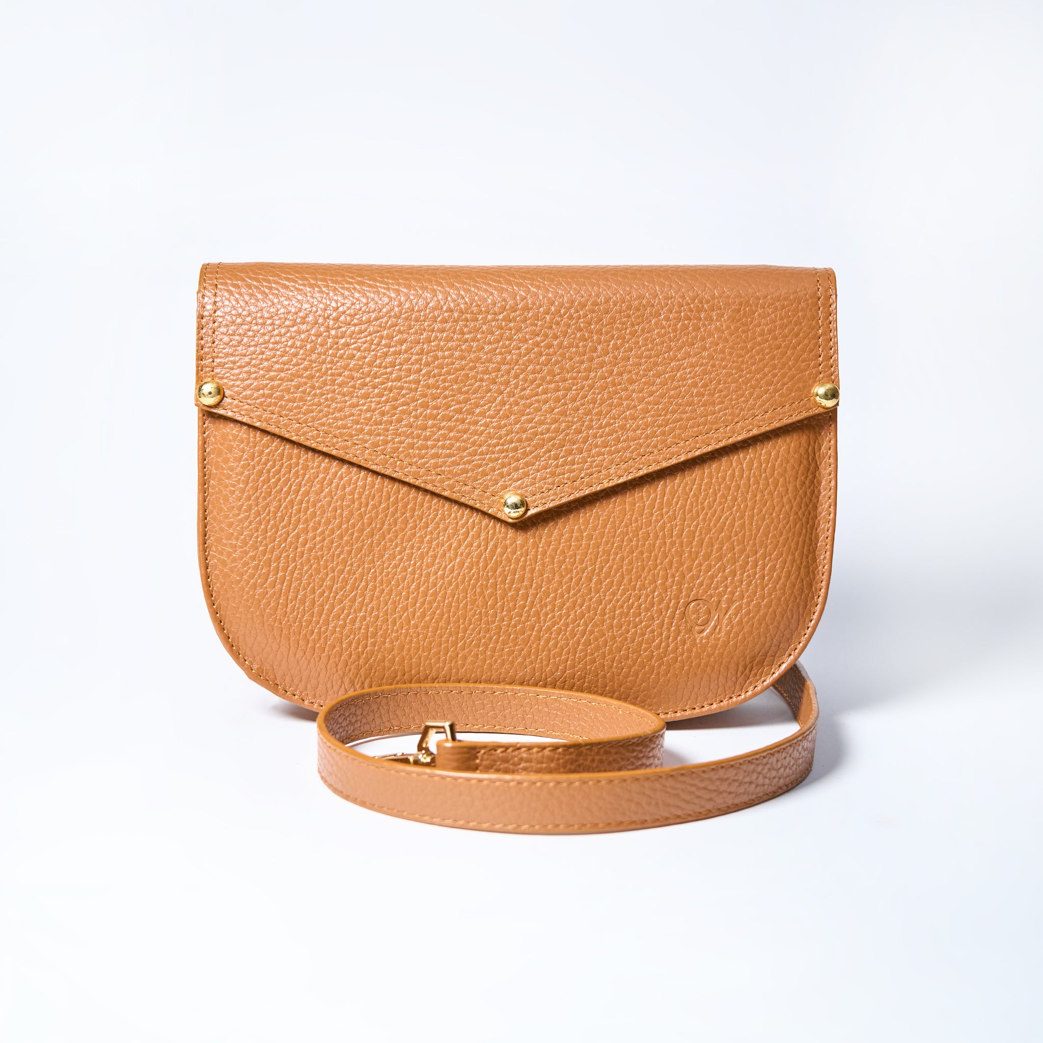 Lyra convertible leather crossbody bag in Honey Brown with adjustable strap, can be worn as a shoulder bag, crossbody, or belt bag. Handcrafted by Oda Nova