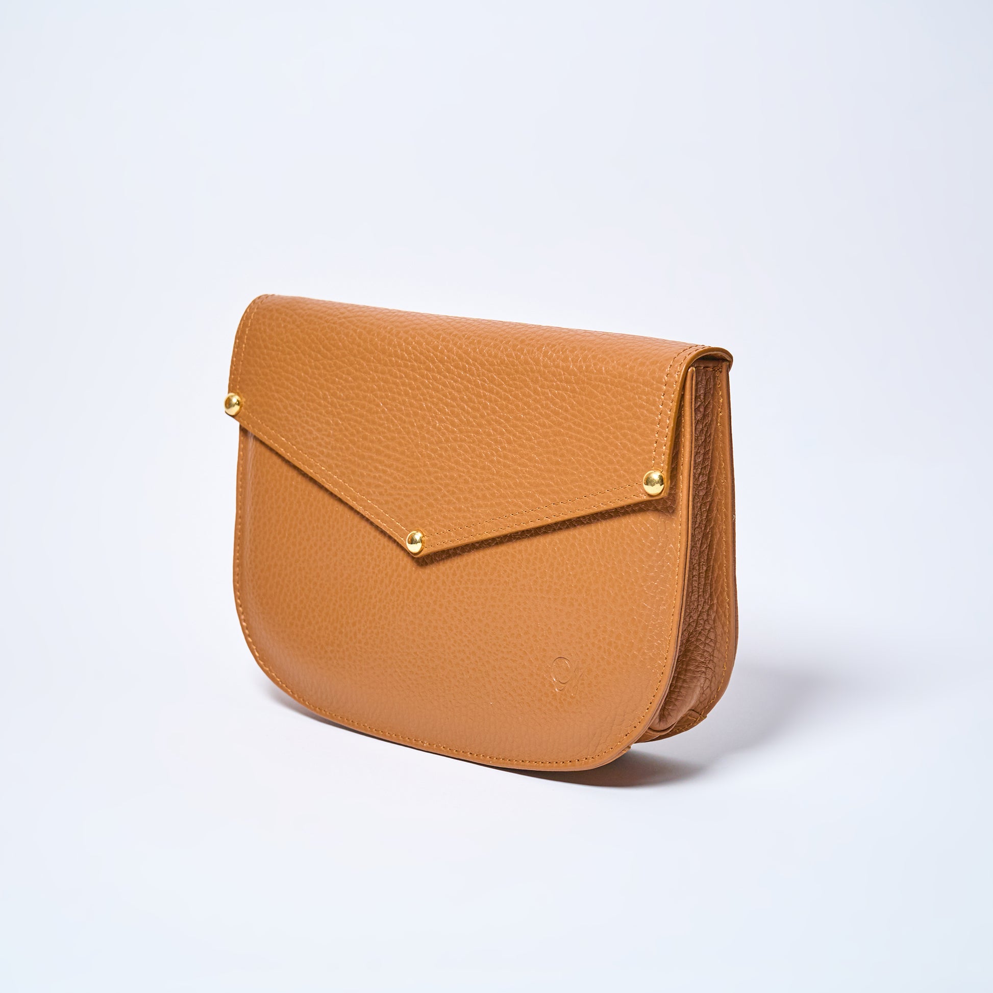 Lyra convertible leather crossbody bag in Honey Brown with adjustable strap, can be worn as a shoulder bag, crossbody, or belt bag. Handcrafted by Oda Nova