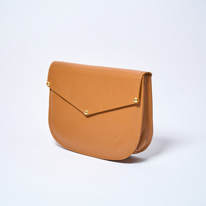 Lyra convertible leather crossbody bag in Honey Brown with adjustable strap, can be worn as a shoulder bag, crossbody, or belt bag. Handcrafted by Oda Nova