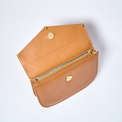 Open Lyra convertible leather crossbody bag in Honey Brown with adjustable strap, can be worn as a shoulder bag, crossbody, or belt bag. Handcrafted by Oda Nova