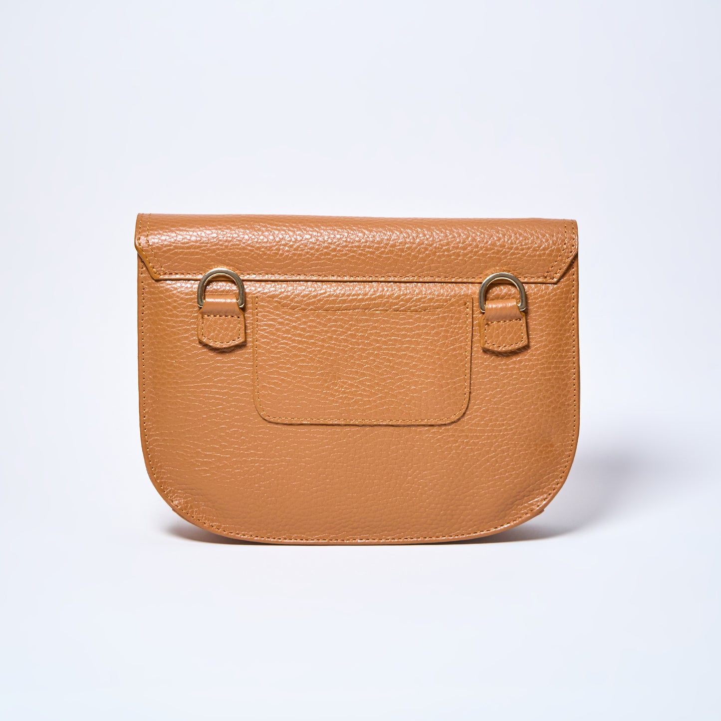 Backside Lyra convertible leather crossbody bag in Honey Brown with adjustable strap, can be worn as a shoulder bag, crossbody, or belt bag. Handcrafted by Oda Nova