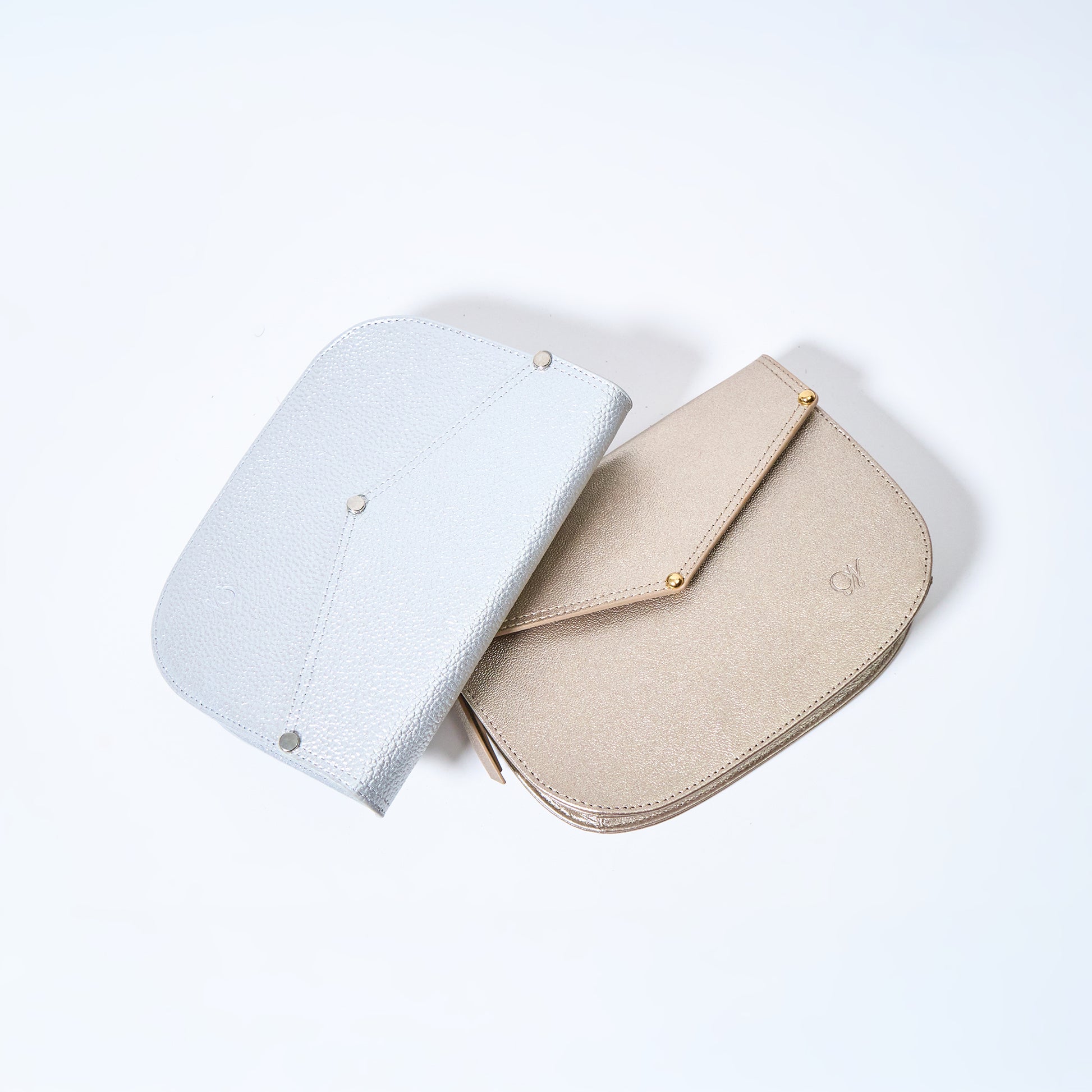 Lyra convertible leather crossbody bags in Stardust Grey and Stardust Gold with adjustable strap, can be worn as a shoulder bag, crossbody, or belt bag. Handcrafted by Oda Nova