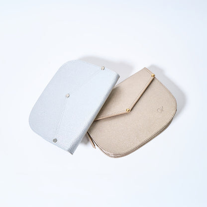 Lyra convertible leather crossbody bags in Stardust Grey and Stardust Gold with adjustable strap, can be worn as a shoulder bag, crossbody, or belt bag. Handcrafted by Oda Nova