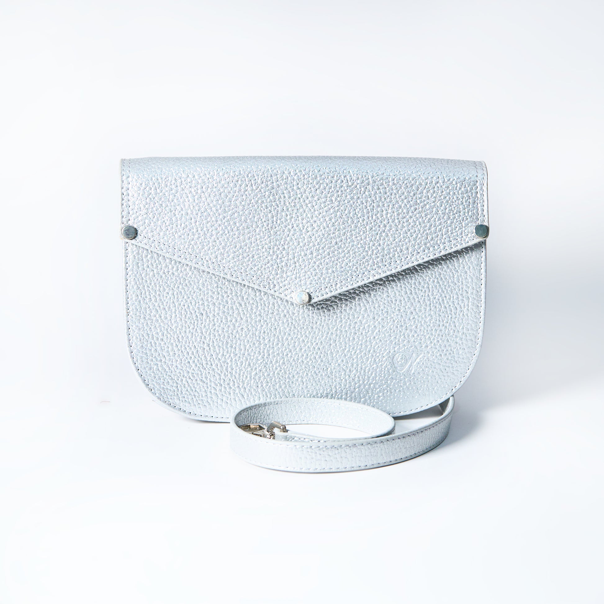 Lyra convertible leather crossbody bag in Stardust Grey with adjustable strap, can be worn as a shoulder bag, crossbody, or belt bag. Handcrafted by Oda Nova