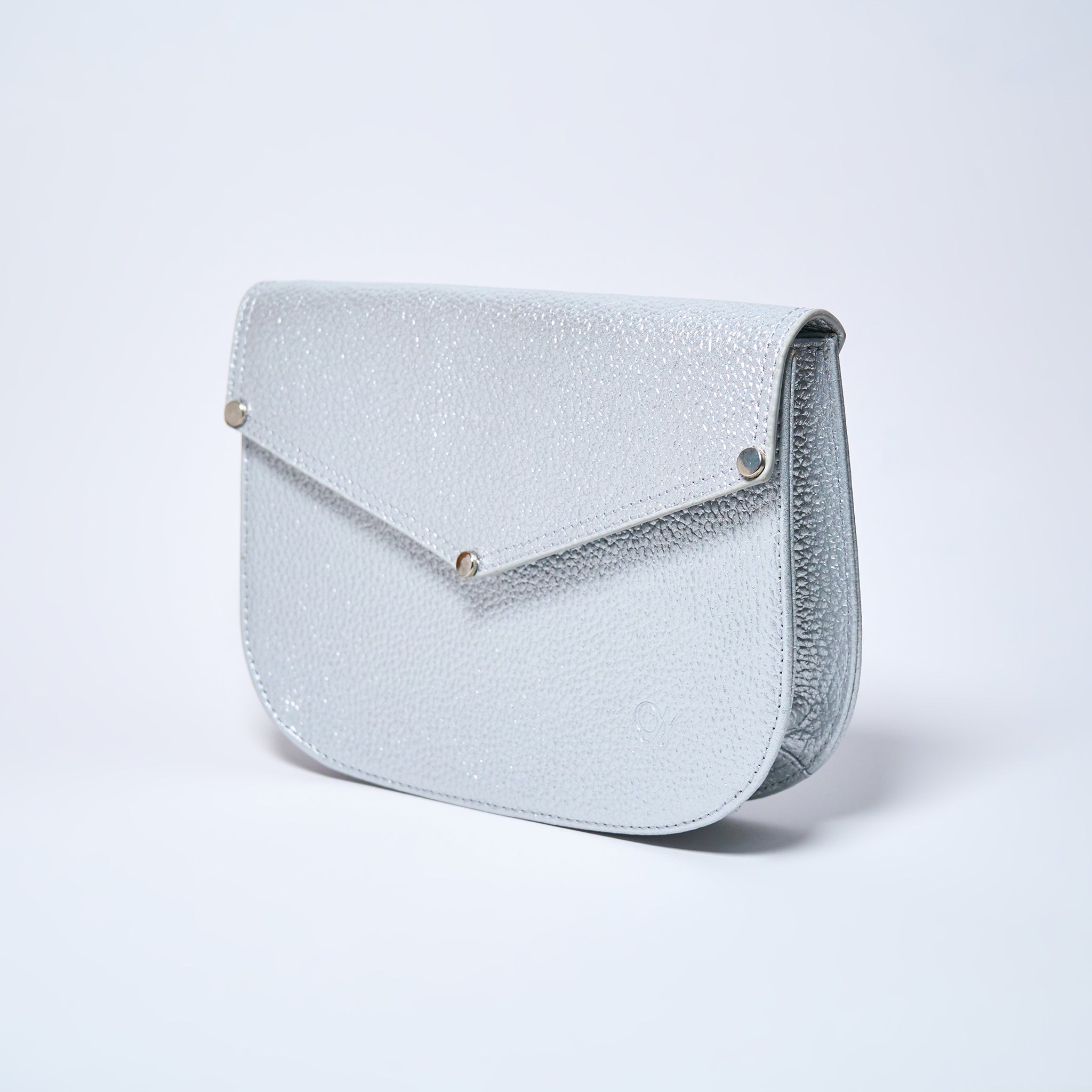 Lyra convertible leather crossbody bag in Stardust Grey with adjustable strap, can be worn as a shoulder bag, crossbody, or belt bag. Handcrafted by Oda Nova