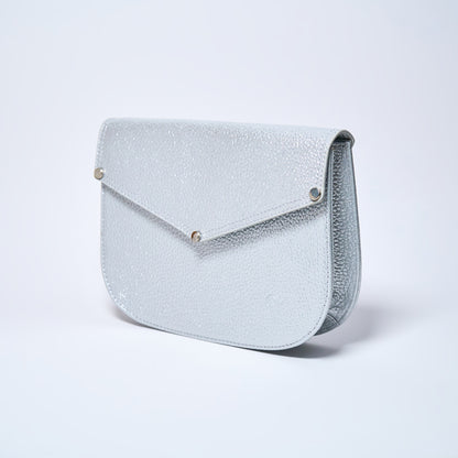 Lyra convertible leather crossbody bag in Stardust Grey with adjustable strap, can be worn as a shoulder bag, crossbody, or belt bag. Handcrafted by Oda Nova