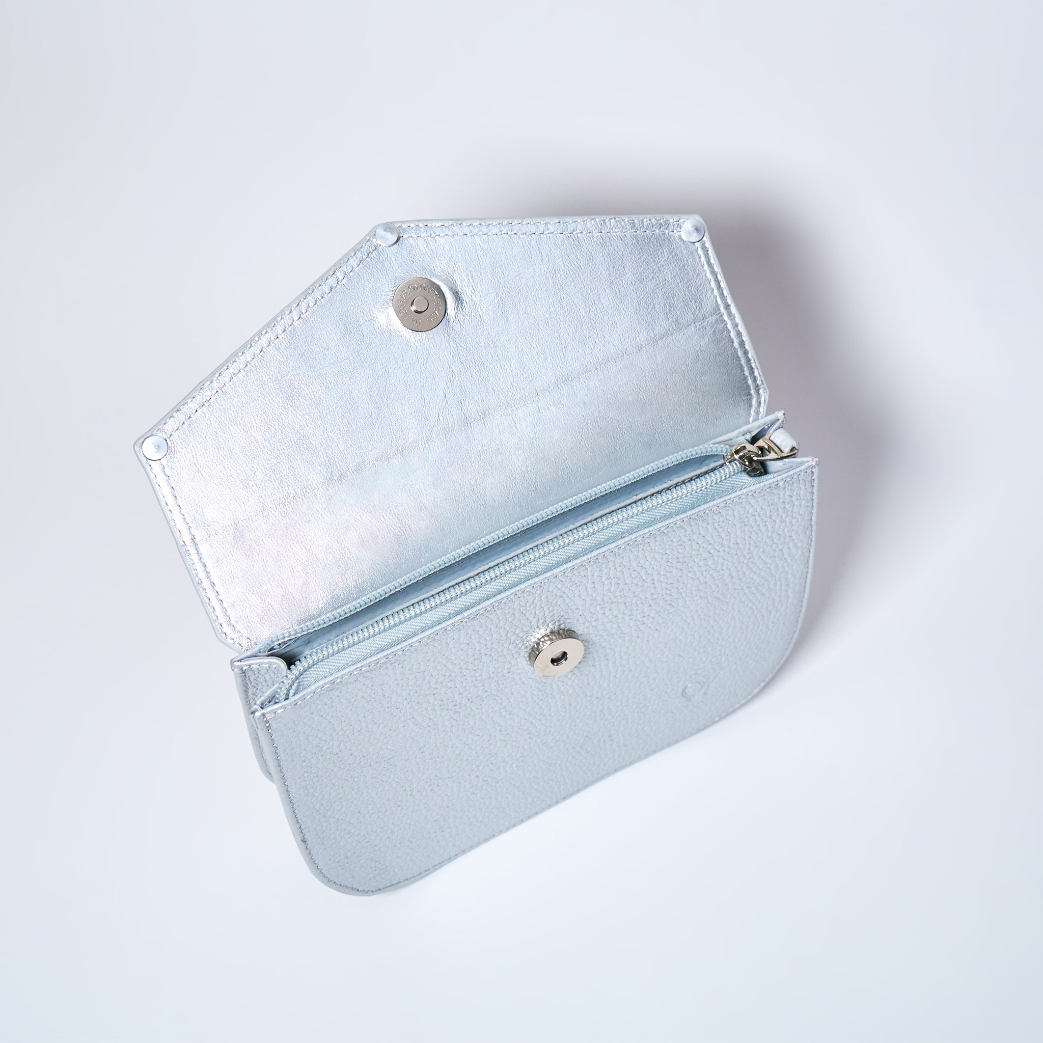 Lyra convertible leather crossbody bag in Stardust Grey with adjustable strap, can be worn as a shoulder bag, crossbody, or belt bag. Handcrafted by Oda Nova