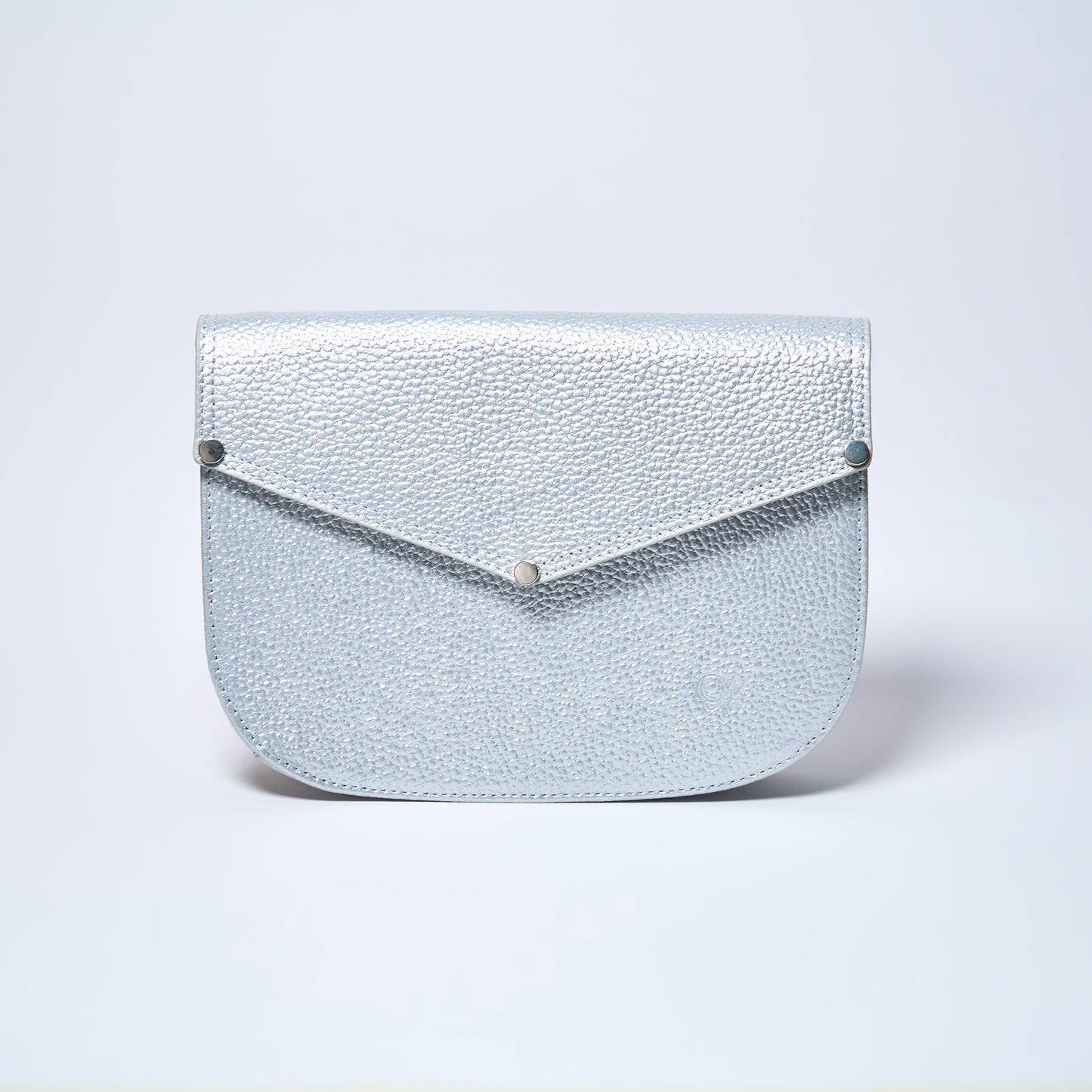 Lyra convertible leather crossbody bag in Stardust Grey with adjustable strap, can be worn as a shoulder bag, crossbody, or belt bag. Handcrafted by Oda Nova