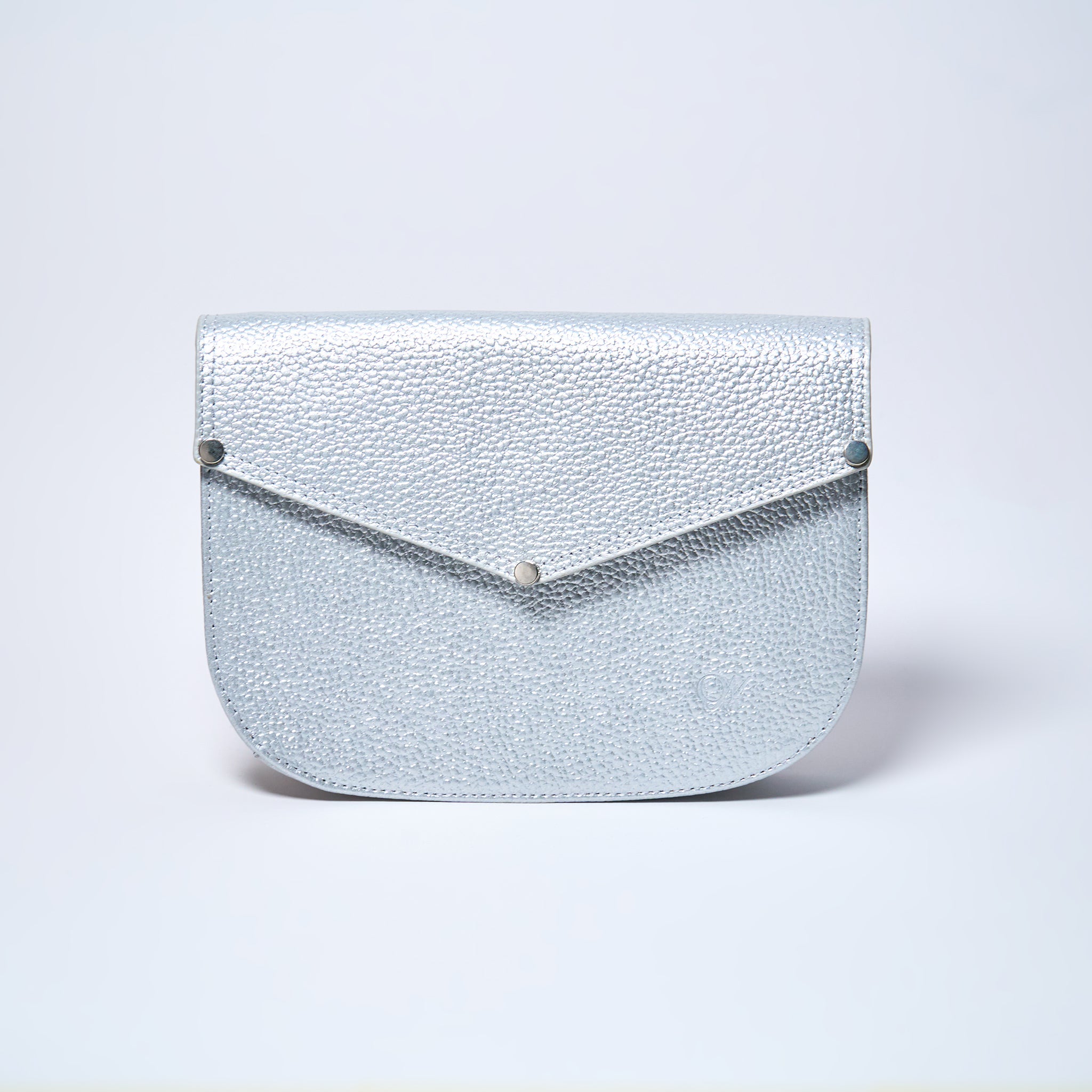 Lyra convertible leather crossbody bag in Stardust Grey with adjustable strap, can be worn as a shoulder bag, crossbody, or belt bag. Handcrafted by Oda Nova